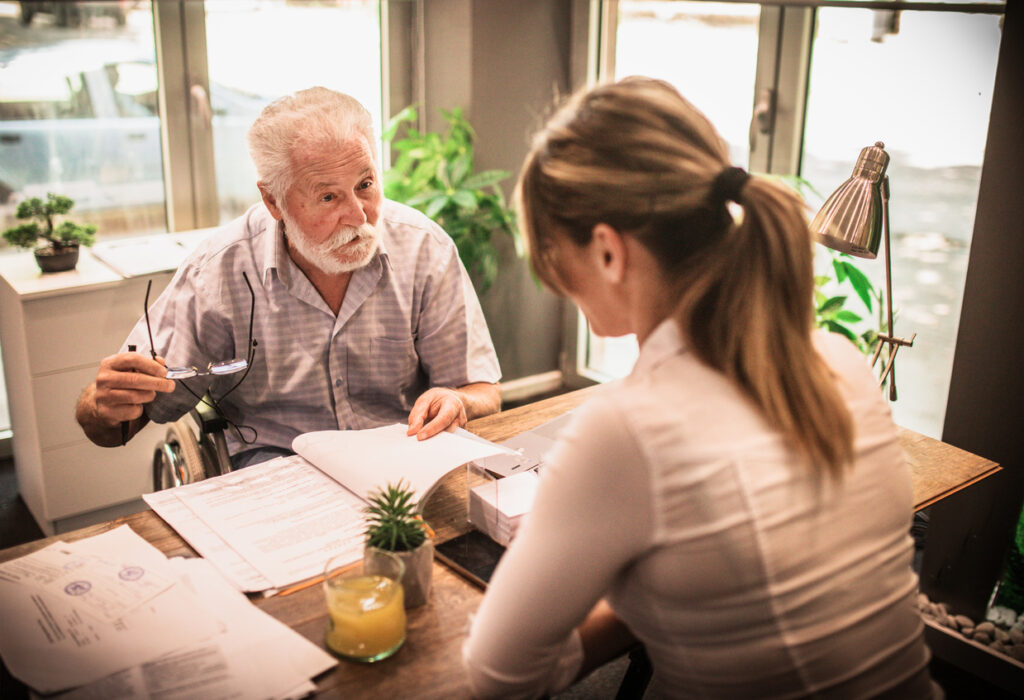 funeral planning in process with person in funeral directors office